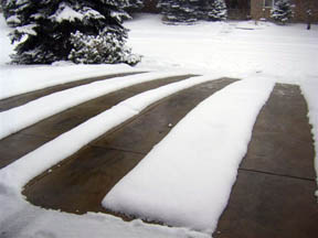 Heated tire tracks in residential concrete heated driveway