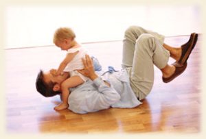 Dad and baby on heated floor