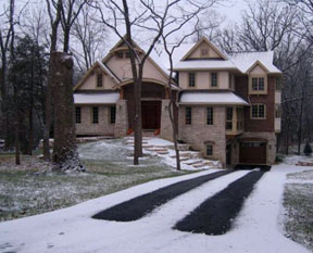 Driveway with heated tire tracks