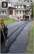 Asphalt driveway being retrofitted with heated tire tracks - 3
