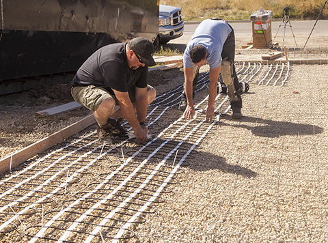 Installing heating mats for electric heated driveway