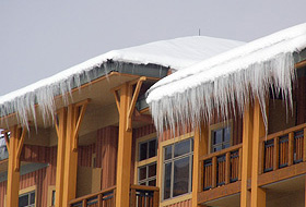 Roof with snow and ice build up, in need of a roof deicing system.
