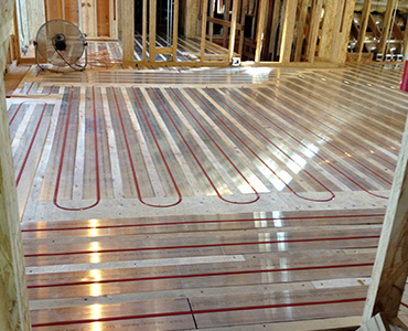 Hydronic floor heating system featuring RAU Panels