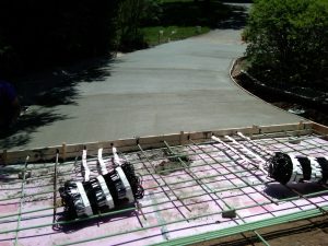 Heated tire tracks in concrete driveway