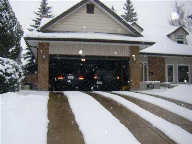 Heated tire tracks in driveway