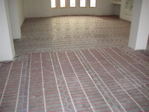 Floor heating mats being installed