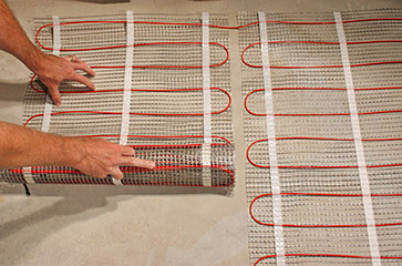 Installing floor heating cable mats