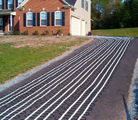 Snow melting heat cable laid out for asphalt heated driveway.