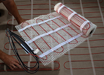 Floor heating cable pre-woven into mat.