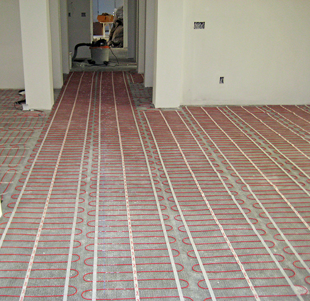 Floor heating cable being installed for heated floor