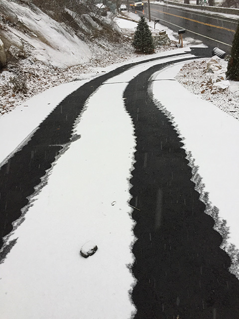 Heated asphalt tire tracks