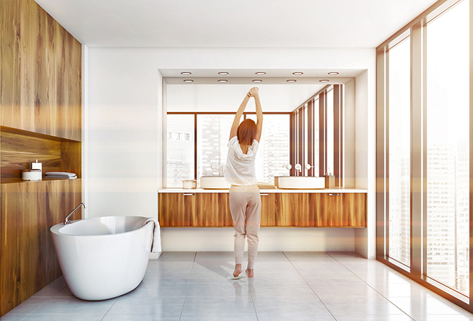 Woman standing in bathroom