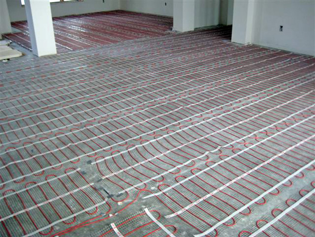 ComfortTile floor heating mats being installed