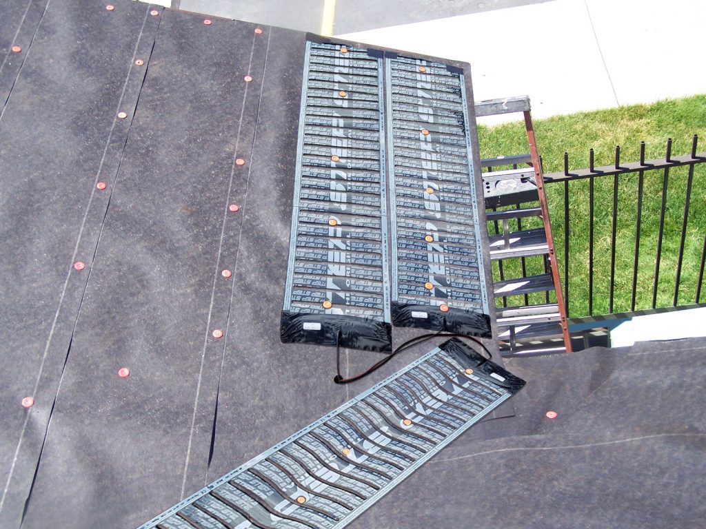 Low-voltage roof de-icing system installed along roof eaves and valley.