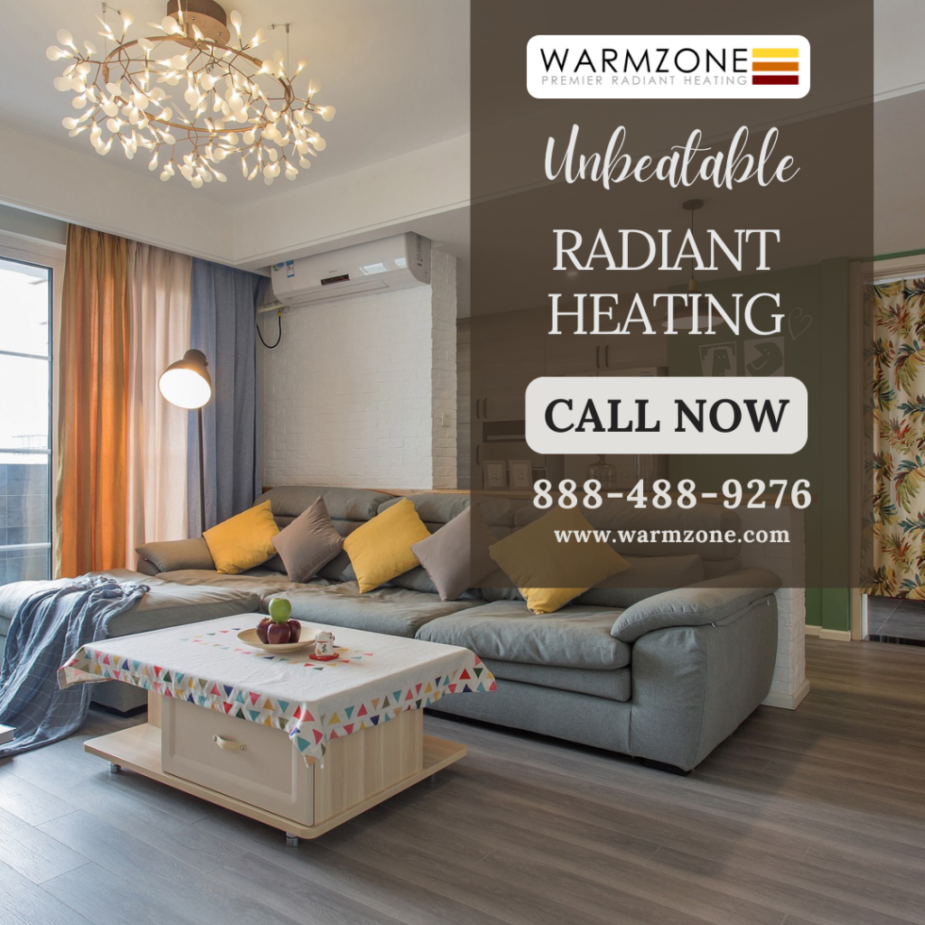 Modern living room with stylish decor, featuring a gray sectional sofa with yellow and gray pillows, a low wooden coffee table with a patterned tablecloth, and a decorative chandelier. An overlay on the right promotes Warmzone radiant heating, with the message “Unbeatable Radiant Heating – Call Now” and contact information including a phone number and website.