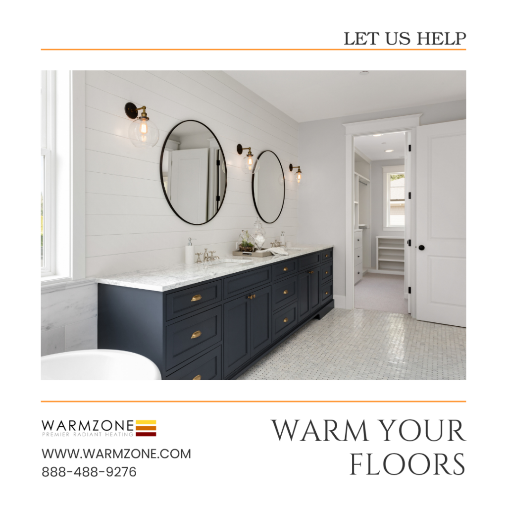 Modern bathroom with a navy-blue double vanity, white shiplap walls, two round mirrors, and a light-colored tiled floor. The text promotes Warmzone radiant floor heating with the message “Warm Your Floors” and contact details at the bottom.