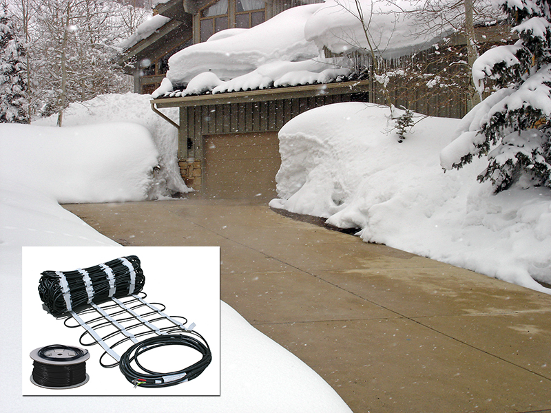 Snow-covered garage of two-story house has driveway free of show. Image has small overlaid image in bottom left-hand corner of heating cable in roll-out mat.