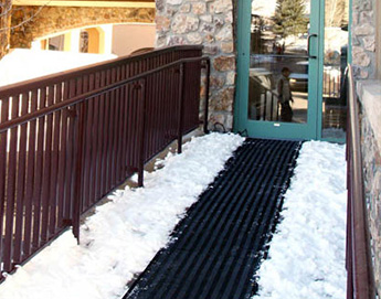 Heated traction mat being used for ramp entry to business