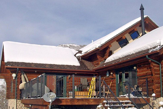 Roof de-icing system installed in roof eaves and valley