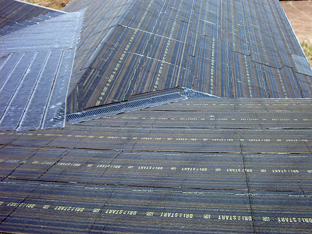 Low-voltage heated roof being installed