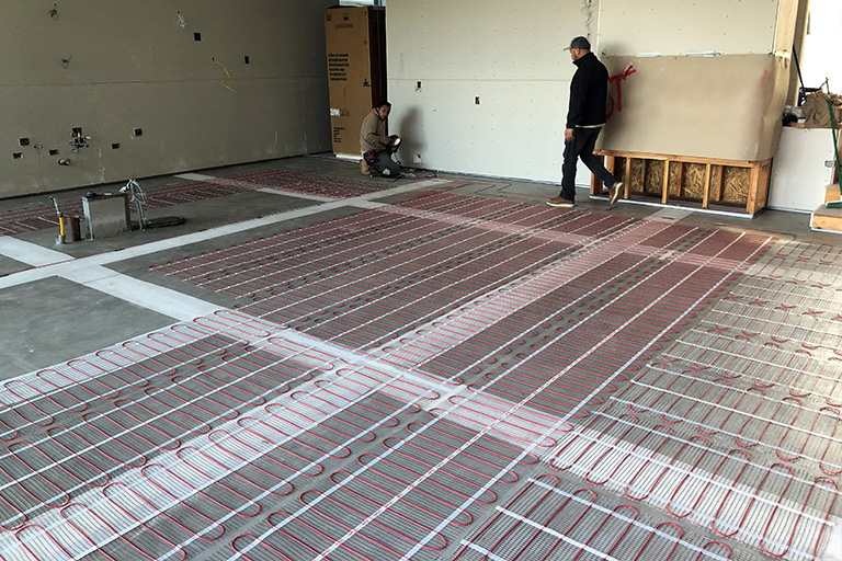 Radiant floor heating system being installed