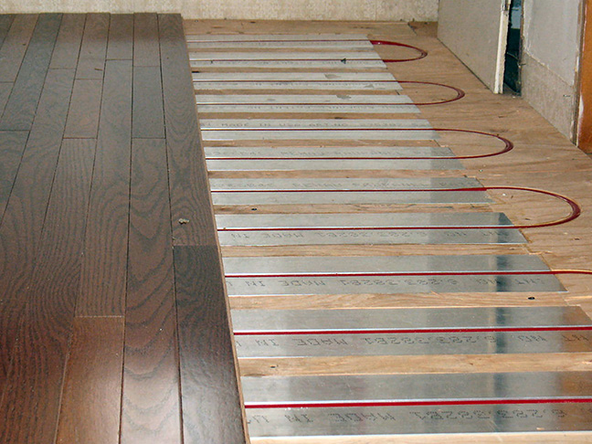 Hydronic floor heating system being installed, using RAUPanels