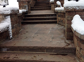 Snow melting system installed in paver steps and heated walkway