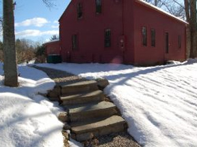 Snow melting system installed in outdoor walkway and concrete steps.