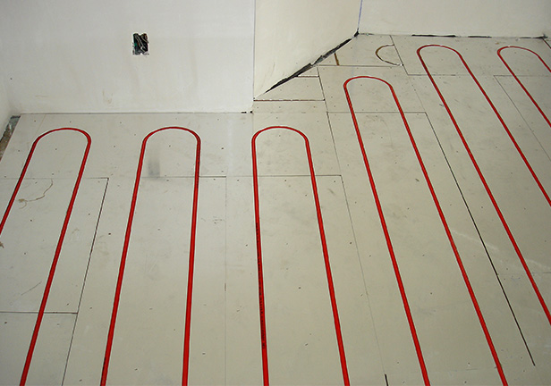 Hydronic floor heating system being installed