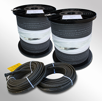 Rolls of self-regulating heat cable