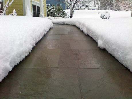 Snow melting system installed under paver sidewalk