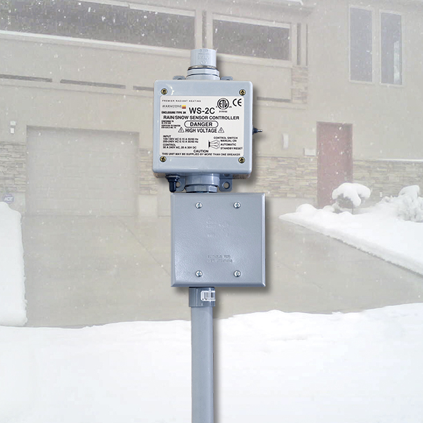 Sample of aerial-mount snow sensor and J-box for an automated heated driveway