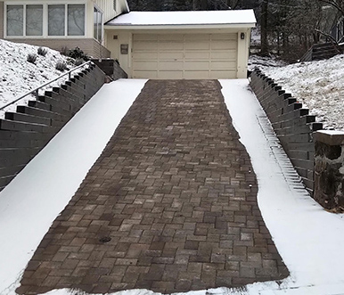 Heated driveway snow melting system under pavers