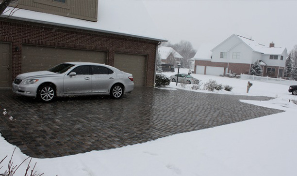 A heated driveway system installed under pavers.