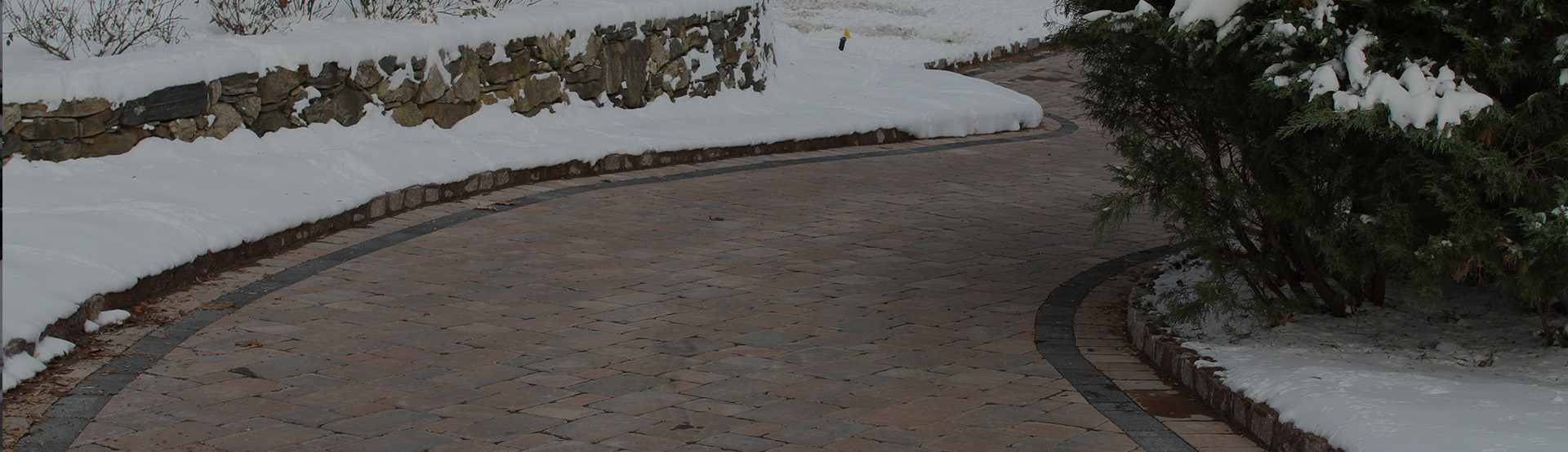 Heated driveway with tire track snow melting system and controls banner