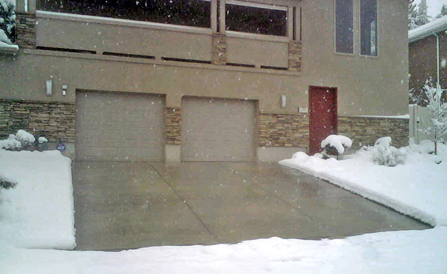 A heated driveway in operation during a snowstorm