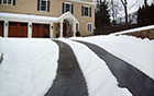 Heated tire tracks in asphalt heated driveway