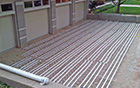 Snow melting mats laid out for heated driveway