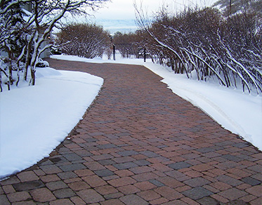 Home with heated paver driveway after a snowstorm