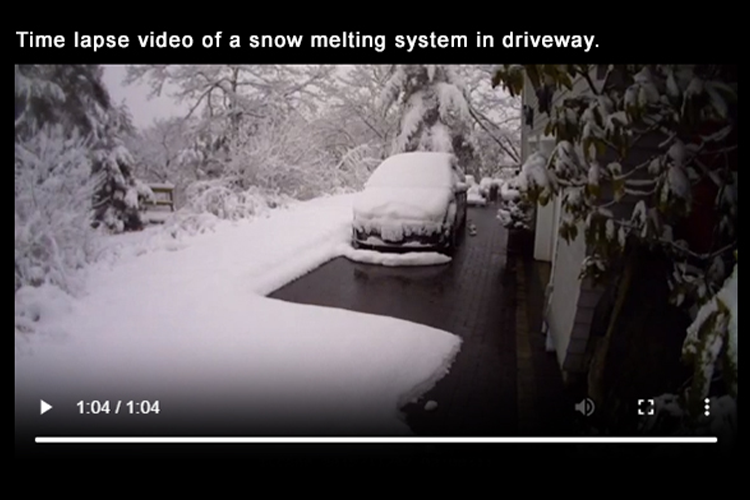Radiant heated driveway snow melting time lapse video