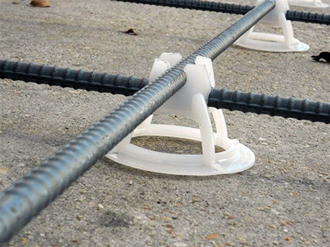 A plastic support (Mesh-Up) shown with remesh for a heated driveway installation